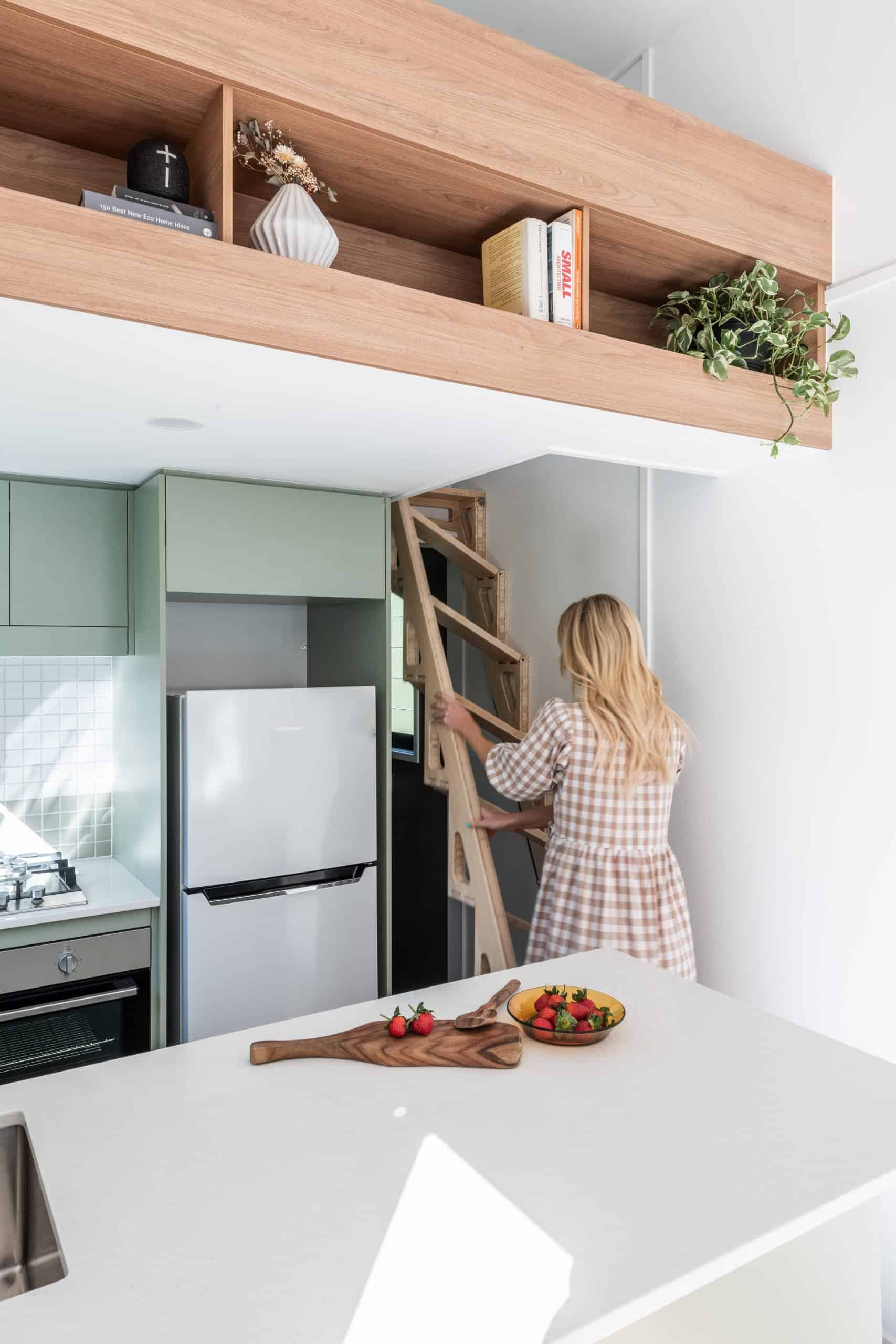 Front view of a compact wooden tiny home in natural lighting.